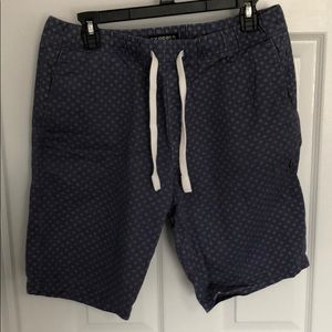 Express patterned blue shorts.